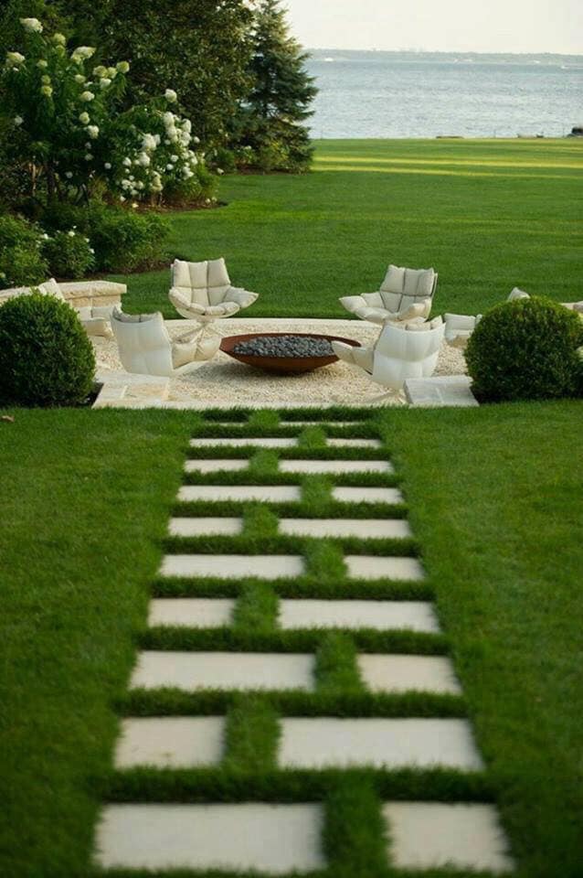Premium lawn, patio, and waterfront outdoor space by Green Horse