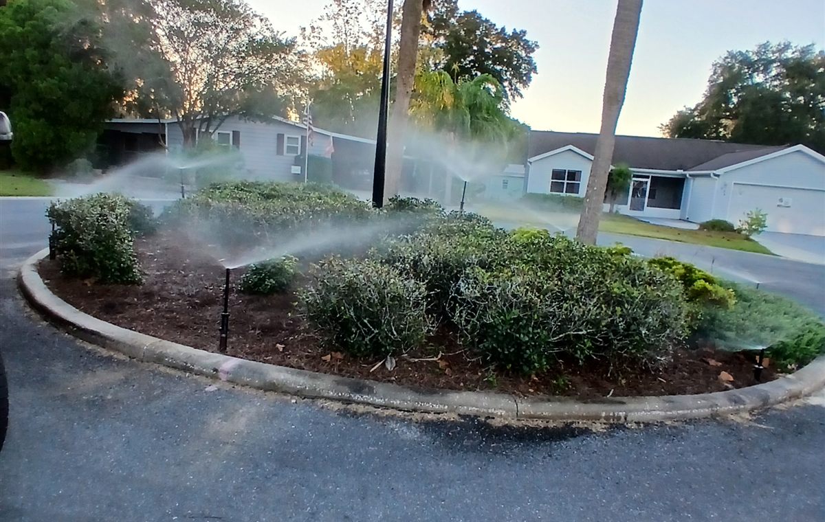 Real sprinkler irrigation running across a Central Florida landscape